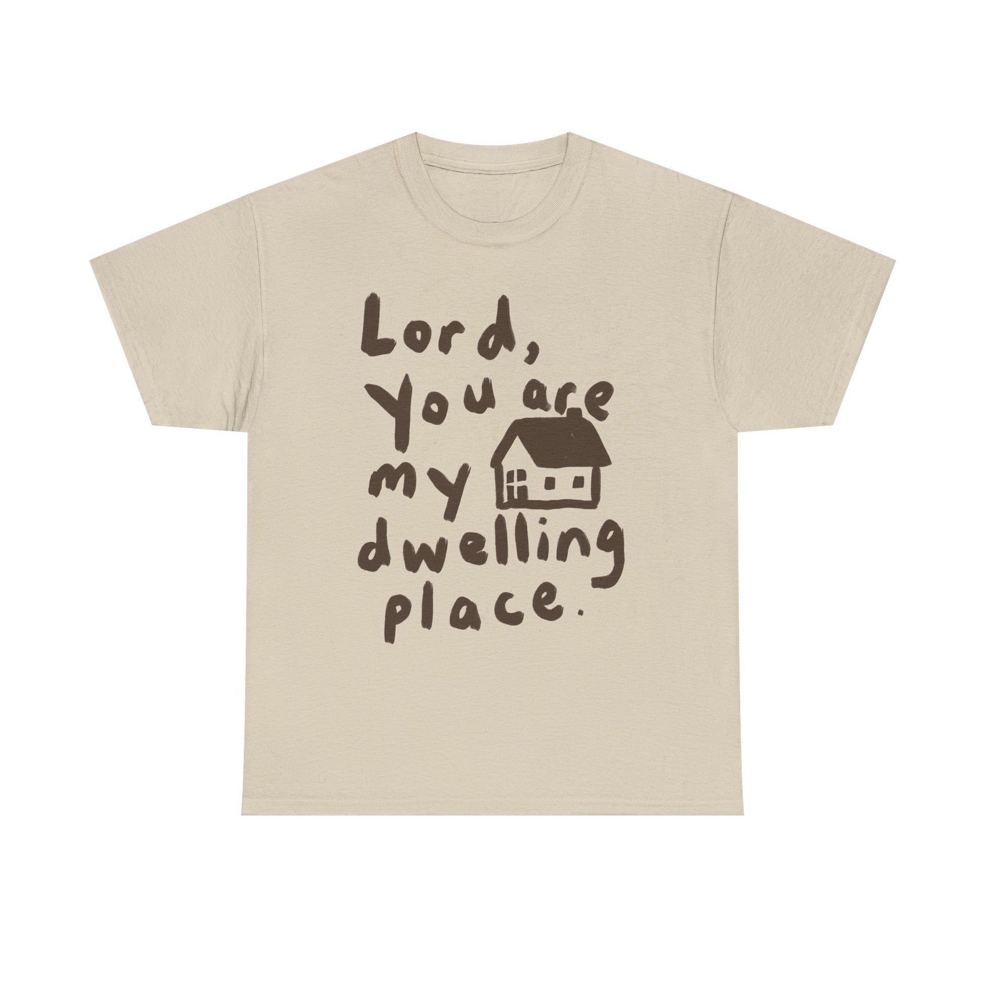 A light beige crewneck t-shirt with a dark brown graphic print that reads 'Lord, You are my dwelling place.' next to a small house illustration, shown on a plain white background.